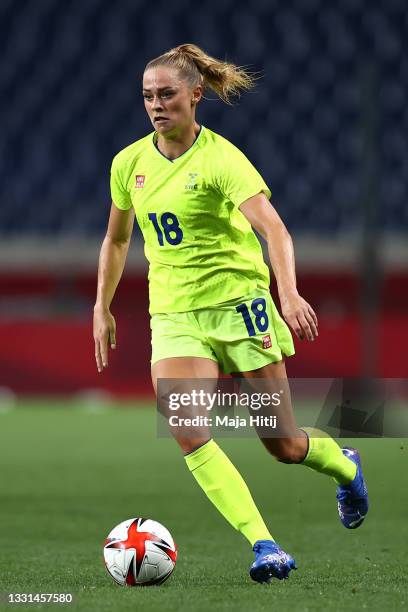 Fridolina Rolfo of Team Sweden runs with the ball during the Women's Quarter Final match between Sweden and Japan on day seven of the Tokyo 2020...