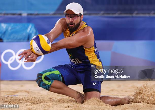 Bruno Oscar Schmidt of Team Brazil competes against Team Poland during the Men's Preliminary - Pool E beach volleyball on day seven of the Tokyo 2020...