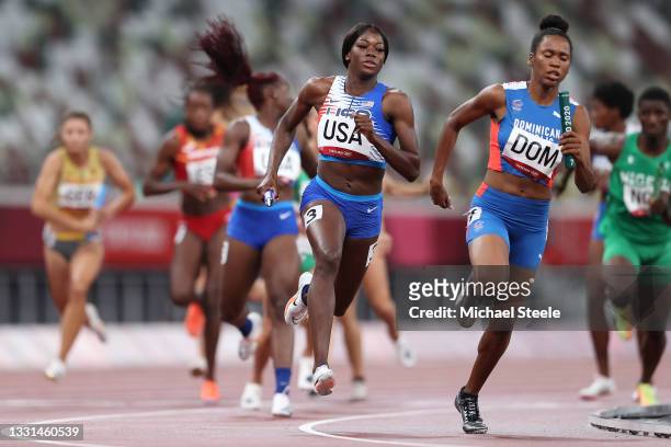 Taylor Manson of Team United States carries the baton while competing in the 4x400 Relay Mixed Round 1 on day seven of the Tokyo 2020 Olympic Games...