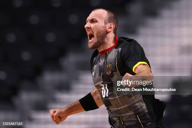 Marcel Schiller of Team Germany celebrates after scoring a goal during the Men's Preliminary Round Group A handball match between Germany and Norway...