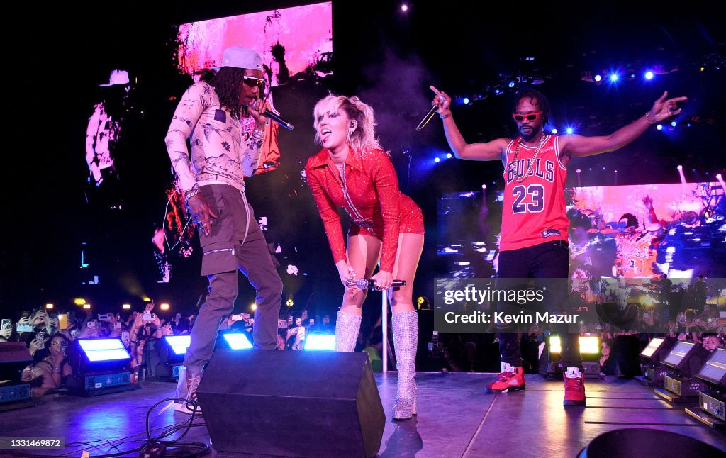 Miley Cyrus Rapper Miley Cyrus performs on stage with Wiz Khalifa and Juicy J during ...
