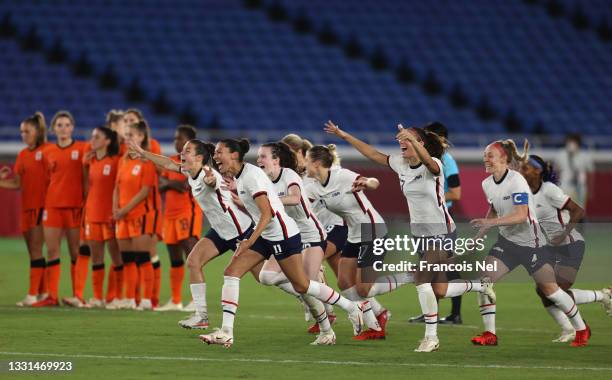Players of Team United States celebrate following their team's victory in the penalty shoot out during the Women's Quarter Final match between...
