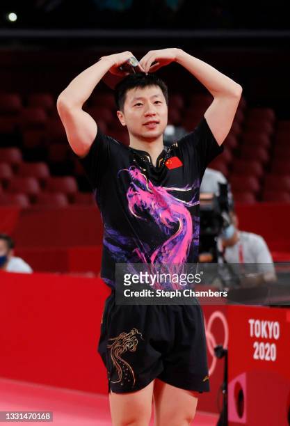 Ma Long of Team China celebrates winning his Men's Singles Gold Medal table tennis match on day seven of the Tokyo 2020 Olympic Games at Tokyo...