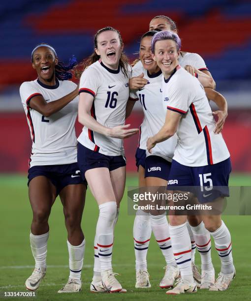 Crystal Dunn, Rose Lavelle, Christen Press and Megan Rapinoe of Team United States celebrate following their team's victory in the penalty shoot out...