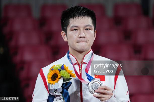 Silver medalist Fan Zhendong of Team China celebrates on the podium after the Men's Table Tennis Singles Final match on day seven of the Tokyo 2020...