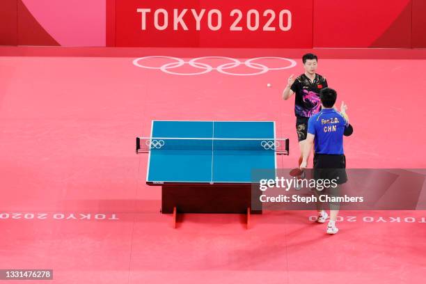 Ma Long of Team China shakes hands with compatriot Fan Zhengdong after winning their Men's Singles Gold Medal table tennis match against his on day...