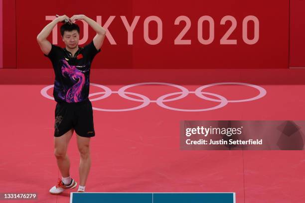 Ma Long of Team China celebrates winning his Men's Singles Gold Medal table tennis match on day seven of the Tokyo 2020 Olympic Games at Tokyo...