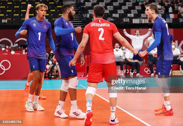 Earvin Ngapeth of Team France reacts with team mates against Team ROC during the Men's Preliminary Round - Pool B volleyball on day seven of the...