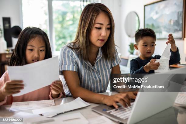 Multitasking Mom Working Asian Photos and Premium High Res Pictures ...