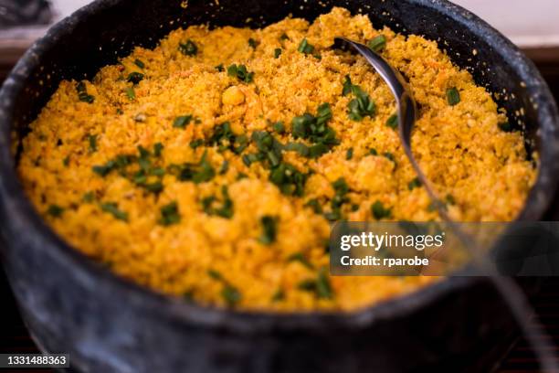 farofa served in a soapstone pan - ouro preto stock pictures, royalty-free photos & images