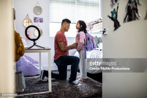 father helping daughter get ready for school - family getting dressed stock pictures, royalty-free photos & images