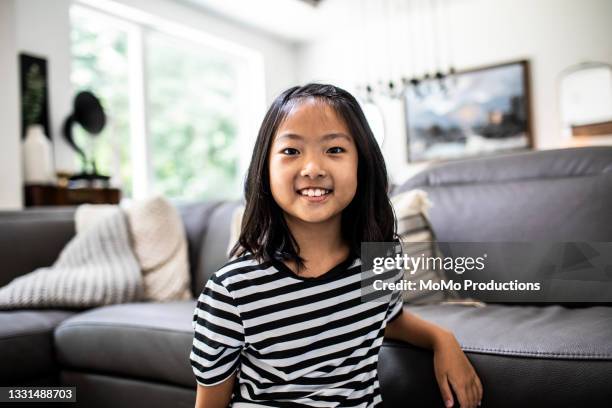 portrait of young girl at home - leanincollection stock pictures, royalty-free photos & images