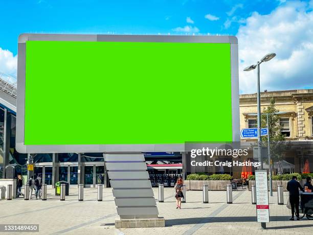 close up large green screen advertisement billboard at translation as commuters go to work. ad space, copy space chroma key, london, uk - london billboard stock pictures, royalty-free photos & images