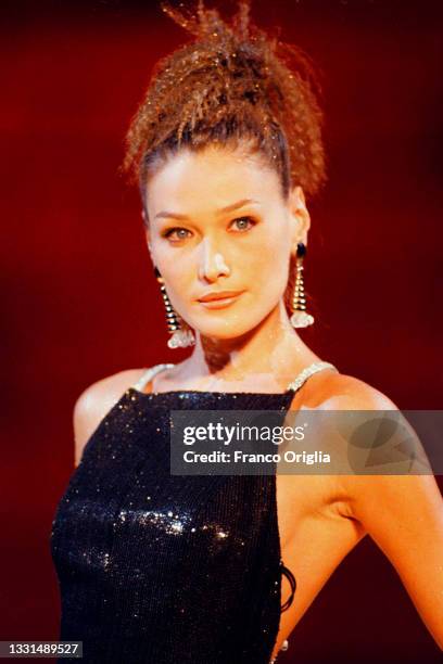 Italian fashion model Carla Bruni wears an evening gown by Gai Mattiolo during the AUTUMN/WINTER HAUTE COUTURE COLLECTIONS: MATTIOLO show at the...