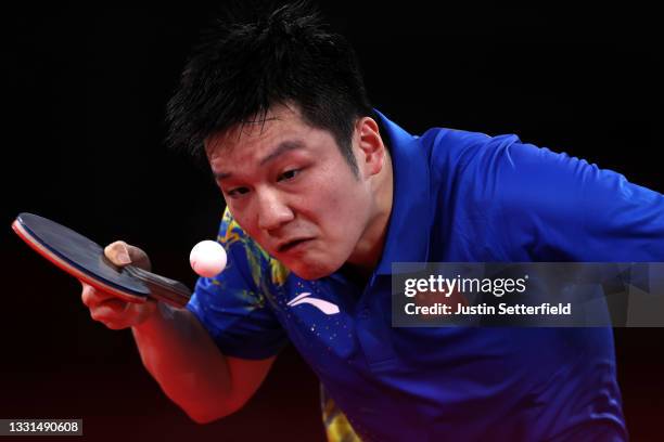 Fan Zhengdong of Team China in action during his Men's Singles Gold Medal table tennis match on day seven of the Tokyo 2020 Olympic Games at Tokyo...