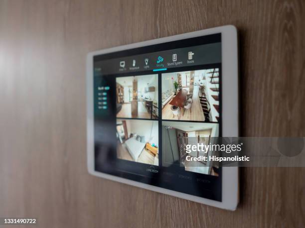 home security system using cameras to monitor the different rooms - övervakningskamera bildbanksfoton och bilder
