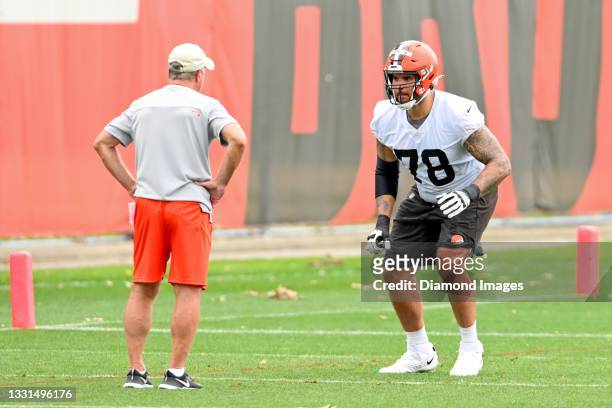 Offensive tackle Jack Conklin of the Cleveland Browns runs a drill as he is instructed by offensive line coach Bill Callahan during the second day of...