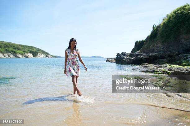 beautiful and playful asian woman at beach. - sri lankan ethnicity stock pictures, royalty-free photos & images