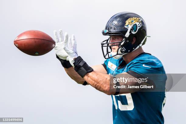 Tim Tebow of the Jacksonville Jaguars catches a pass during Training Camp at TIAA Bank Field on July 30, 2021 in Jacksonville, Florida.