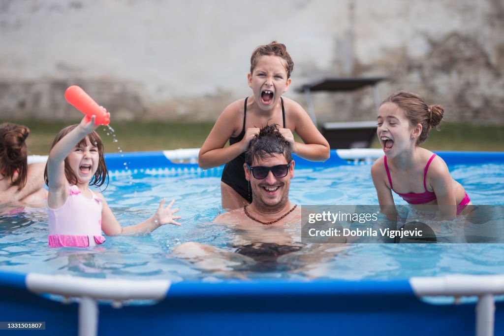 Kid In Pool With Parent Silly Kids And Their Happy Parent At Swimming Pool At Home High-Res ...