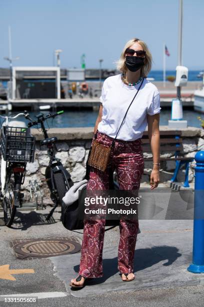 Karolina Kurkova is seen arriving in Capri ahead of the UNICEF italia and LuisaViaRoma summer gala on July 30, 2021 in Capri, Italy.