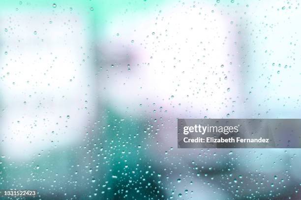 abstract raindrops on the window glass - translucent glass stock pictures, royalty-free photos & images