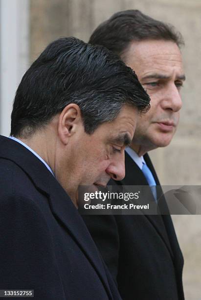 France's Prime Minister, François Fillon and French Industry Minister Eric Besson leave the weekly cabinet meeting at Elysee Palace on February 2,...