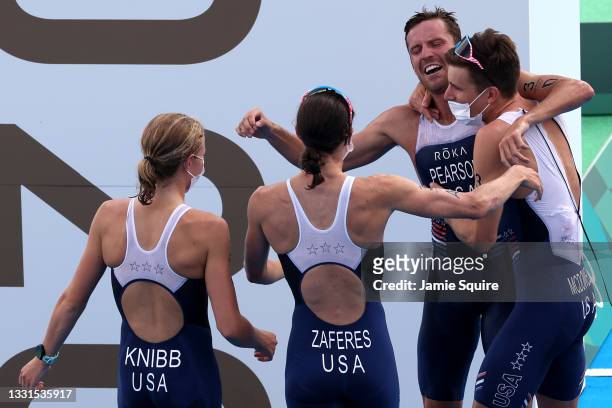 Morgan Pearson of Team United States celebrates winning silver with teammates Katie Zaferes, Kevin McDowell and Taylor Knibb of Team United States...