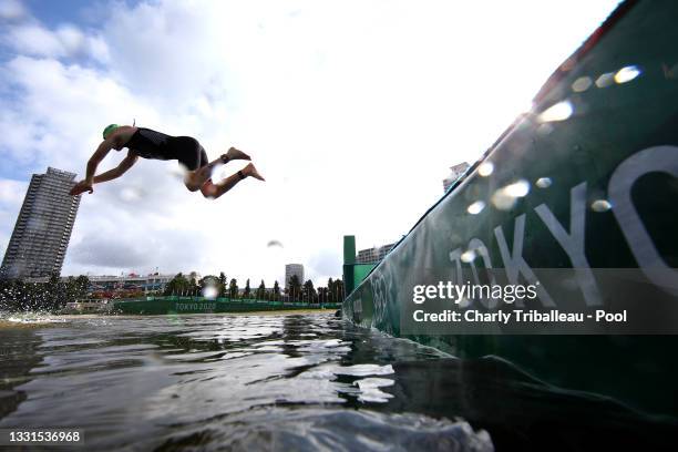 Tayler Reid of Team New Zealand dives during the Mixed Relay Triathlon on day eight of the Tokyo 2020 Olympic Games at Odaiba Marine Park on July 31,...