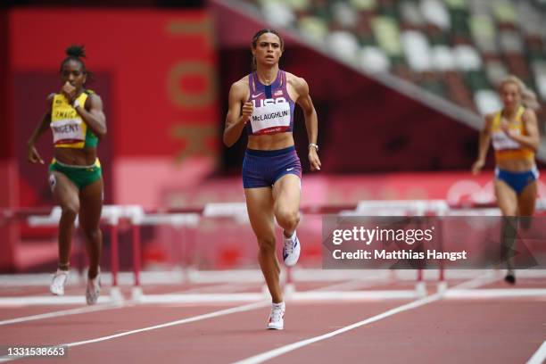 Sydney McLaughlin of Team United States competes in round one of the Women's 400m hurdles heats on day eight of the Tokyo 2020 Olympic Games at...