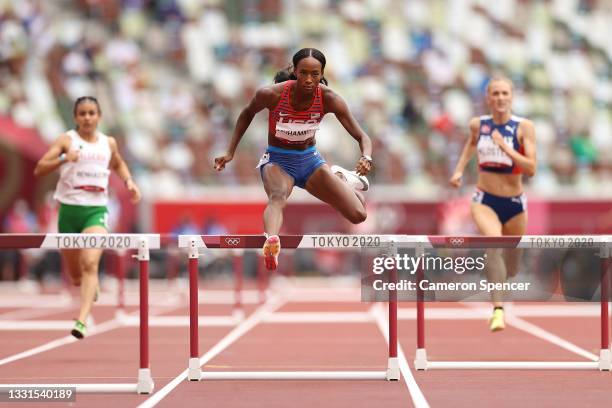 Dalilah Muhammad of Team United States leads in round one of the Women's 400m hurdles heats on day eight of the Tokyo 2020 Olympic Games at Olympic...