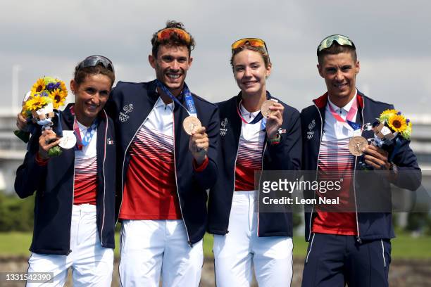 Bronze medalists Leonie Periault, Dorian Coninx, Cassandre Beaugrand and Vincent Luis of Team France pose with their medals on the podium during the...