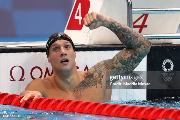 Caeleb Dressel of Team United States celebrates winning the gold medal and breaking the world record competing in the Men’s 100m Butterfly Final at...