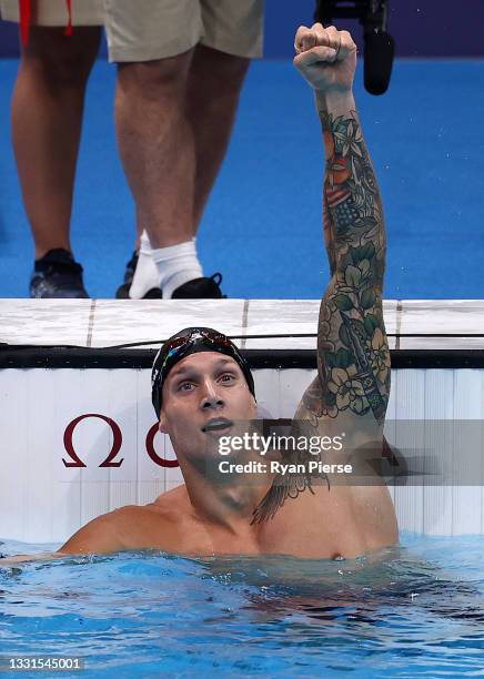 Caeleb Dressel of Team United States celebrates winning the gold medal in the Men's 100m Butterfly Final at Tokyo Aquatics Centre on July 31, 2021 in...