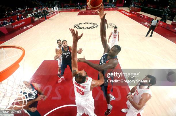 Moustapha Fall of Team France goes up for a shot Hamed Haddadi of Team Iran during the first half of a Men's Basketball Preliminary Round Group A...