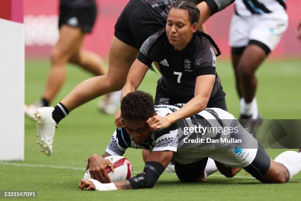 Vasiti Solikoviti of Team Fiji scores a try under pressure from Tyla Nathan-Wong of Team New Zealand in the Women’s Semi Final match between Team New...