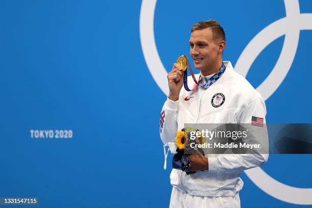Gold medalist Caeleb Dressel of Team United States poses with the gold medal for the Men's 100m Butterfly Final at Tokyo Aquatics Centre on July 31,...