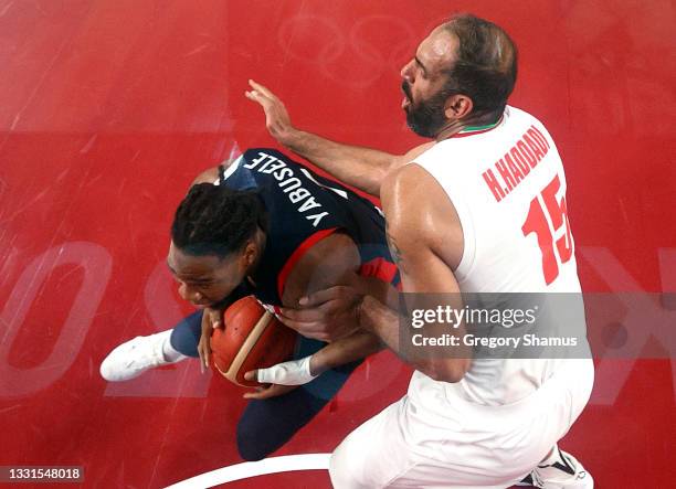 Hamed Haddadi of Team Iran defends against Guerschon Yabusele of Team France during the first half of a Men's Basketball Preliminary Round Group A...