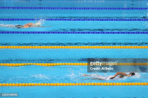 Katie Ledecky of Team United States leads Ariarne Titmus of Team Australia during the Women's 800m Freestyle Final at Tokyo Aquatics Centre on July...