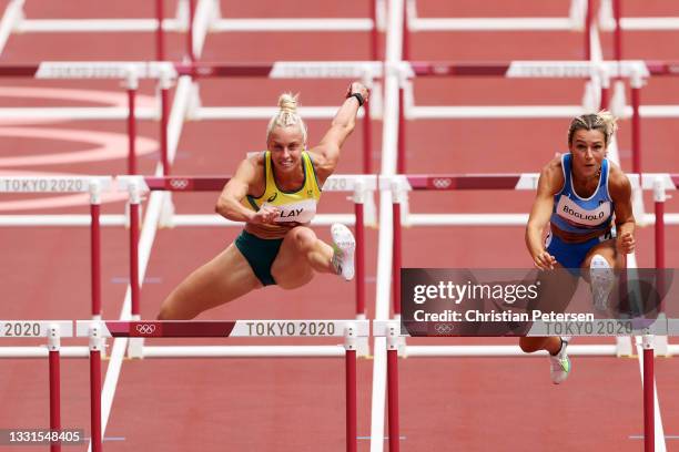 Liz Clay of Team Australia and Luminosa Bogliolo of Team Italy compete in the Women's 100m hurdles heats on day eight of the Tokyo 2020 Olympic Games...