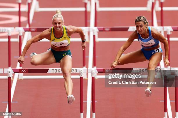 Liz Clay of Team Australia and Luminosa Bogliolo of Team Italy compete in the Women's 100m hurdles heats on day eight of the Tokyo 2020 Olympic Games...