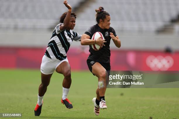 Theresa Fitzpatrick of Team New Zealand is tackled by Laisana Likuceva of Team Fiji in the Women’s Semi Final match between Team New Zealand and Team...