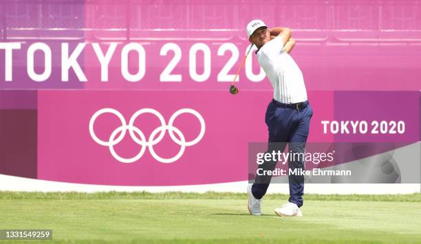 Xander Schauffele of Team United States plays his shot from the first tee during the third round of the Men's Individual Stroke Play on day eight of...