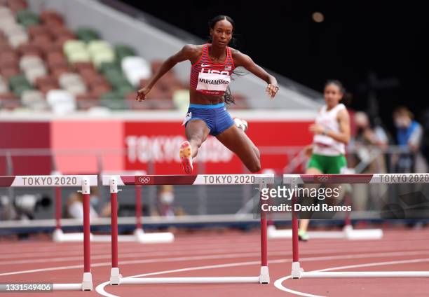 Dalilah Muhammad of Team United States competes in round one of the Women's 400m hurdles heats on day eight of the Tokyo 2020 Olympic Games at...