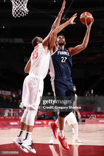 Rudy Gobert of Team France shoots against Hamed Haddadi of Team Iran during the second half of a Men's Basketball Preliminary Round Group A game on...