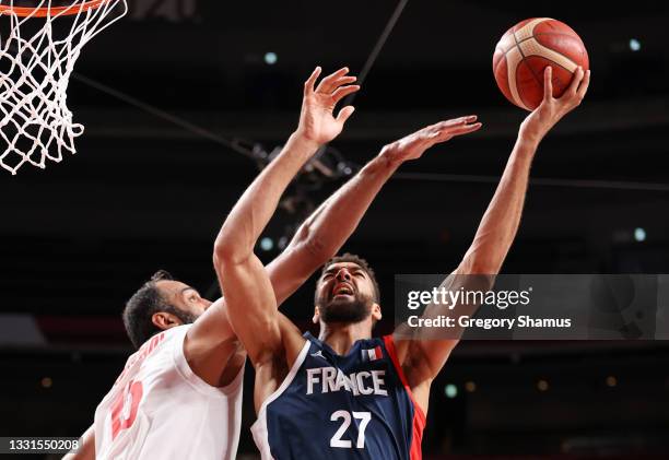 Rudy Gobert of Team France shoots against Hamed Haddadi of Team Iran during the second half of a Men's Basketball Preliminary Round Group A game on...