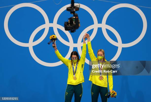 Gold medalist Kaylee McKeown of Team Australia and bronze medalist Emily Seebohm of Team Australia pose on the podium during the medal ceremony for...