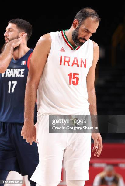 Hamed Haddadi of Team Iran hangs his head as he walks off the court after a loss to France during a Men's Basketball Preliminary Round Group A game...