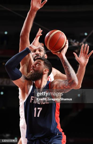 Vincent Poirier of Team France goes up for a shot against Hamed Haddadi of Team Iran during the second half of a Men's Basketball Preliminary Round...