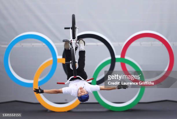 Rim Nakamura of Japan performs a blackflip in front of the Olympic rings logo during the Men's BMX Freestyle seeding event, run 2 on day eight of the...